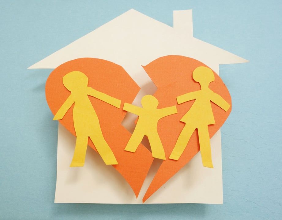 cutout of house and broken family