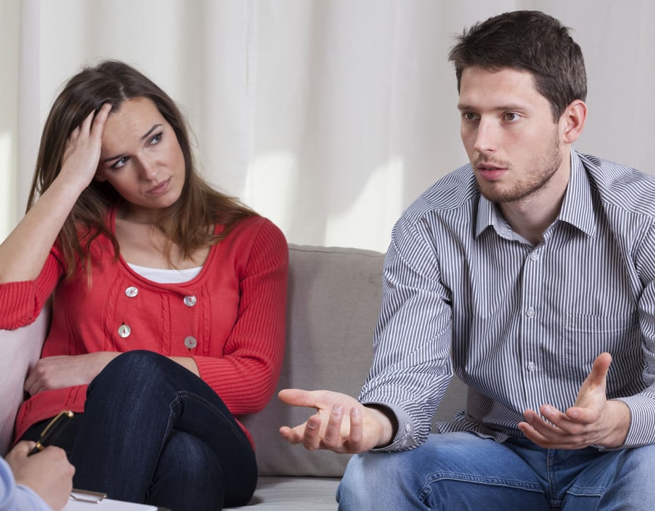 couple arguing on couch
