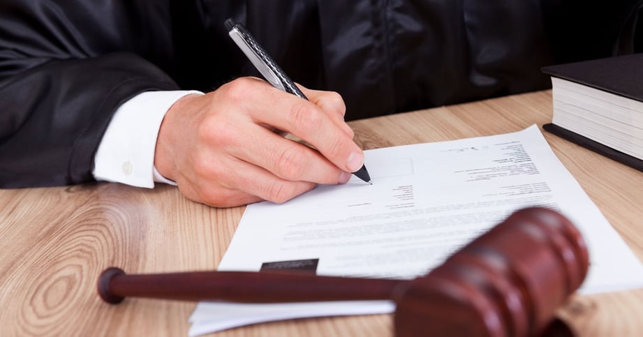 judge signing papers