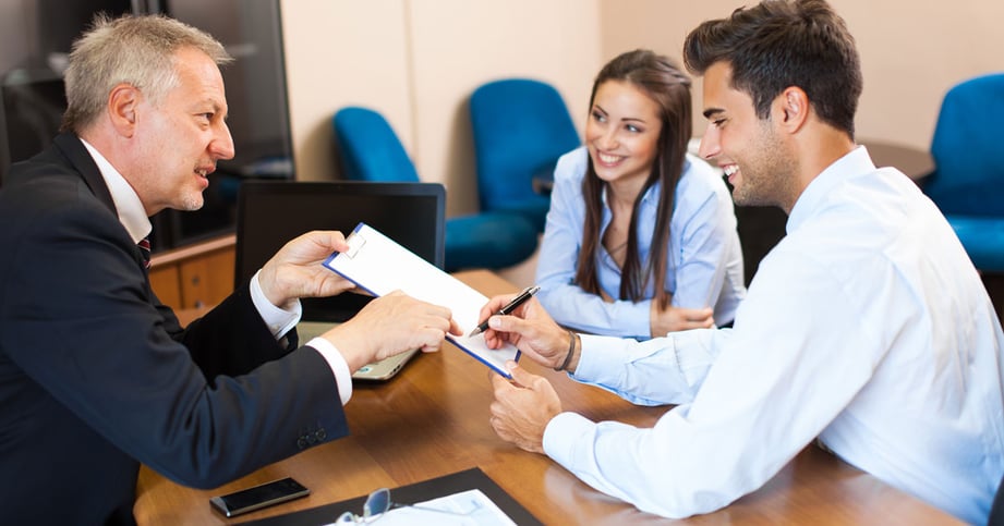 lawyer showing agreement to couple